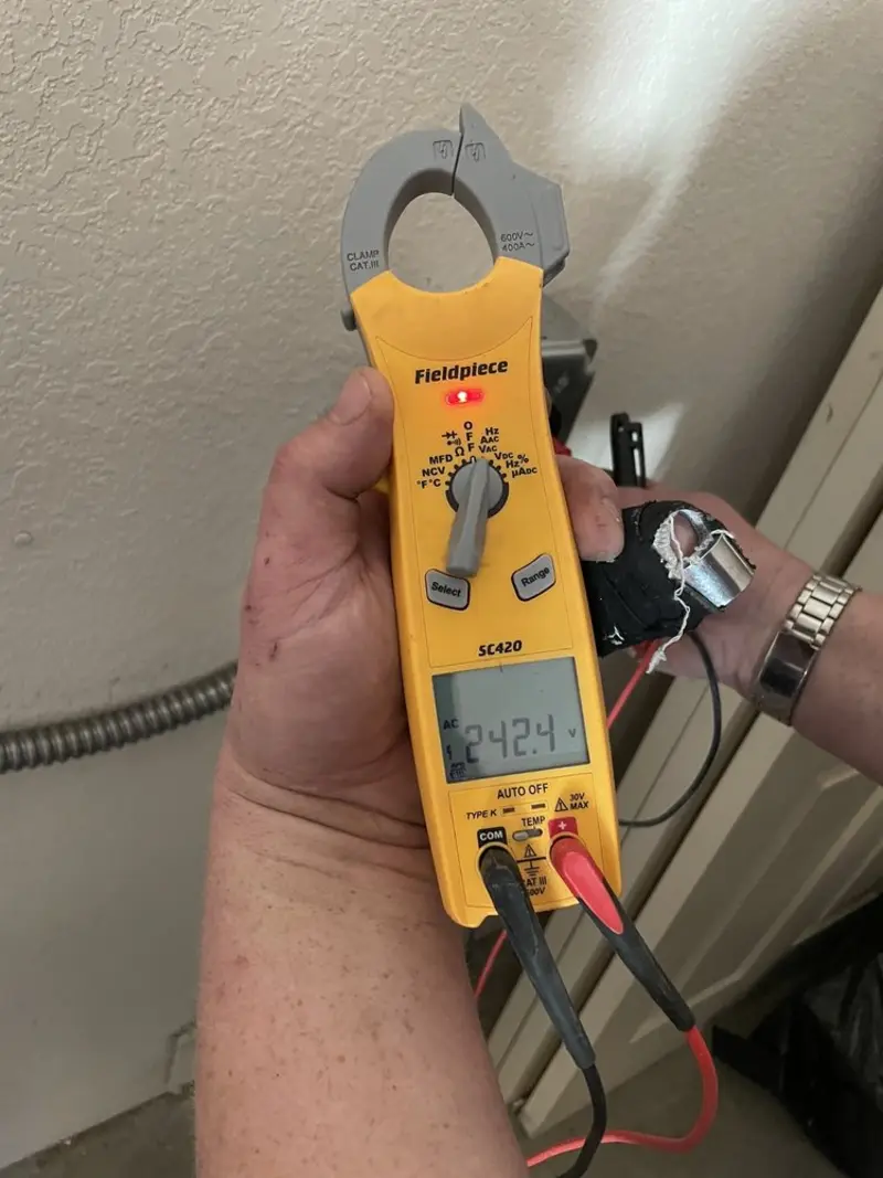 Voltage testing with clamp meter during Outlet Installation in Lee